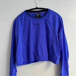 Nike DriFit Purple Long Sleeve. Fits a small to medium